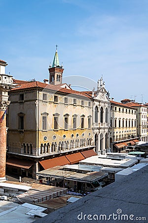 A view of the market in Piazza dei Signori with the facade of Palazzo di Monte di PietÃƒÂ  behind, Vicenza Editorial Stock Photo